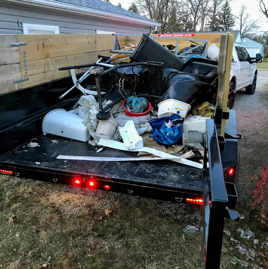 Roll-off dumpster delivered to a residential driveway in Fort Rucker
